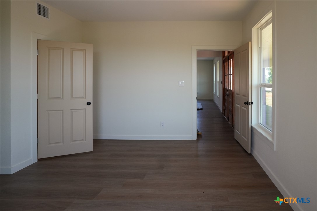 5688 Falke-Heinrich Road Schulenburg, TX 78956 - Photo 22 of 34 a view of a hallway with wooden floor