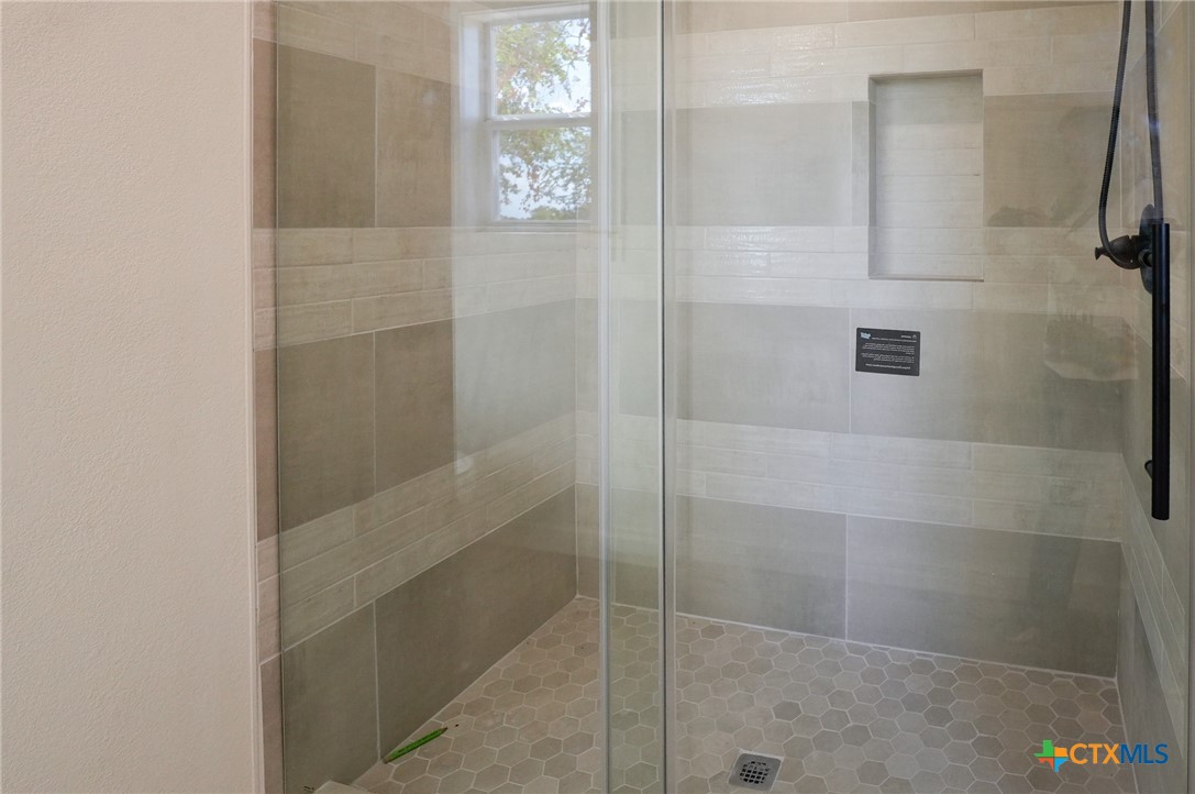 5688 Falke-Heinrich Road Schulenburg, TX 78956 - Photo 25 of 34 a bathroom with a glass shower door