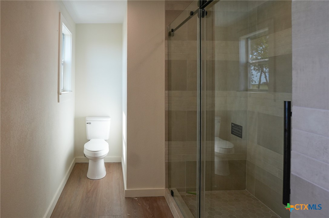 5688 Falke-Heinrich Road Schulenburg, TX 78956 - Photo 26 of 34 a bathroom with a toilet and a shower