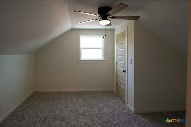 a bathroom with a bath tub with a shower