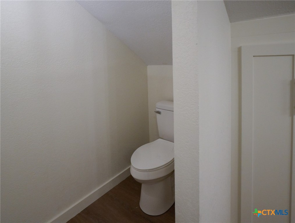 5688 Falke-Heinrich Road Schulenburg, TX 78956 - Photo 32 of 34 a white toilet sitting in a bathroom