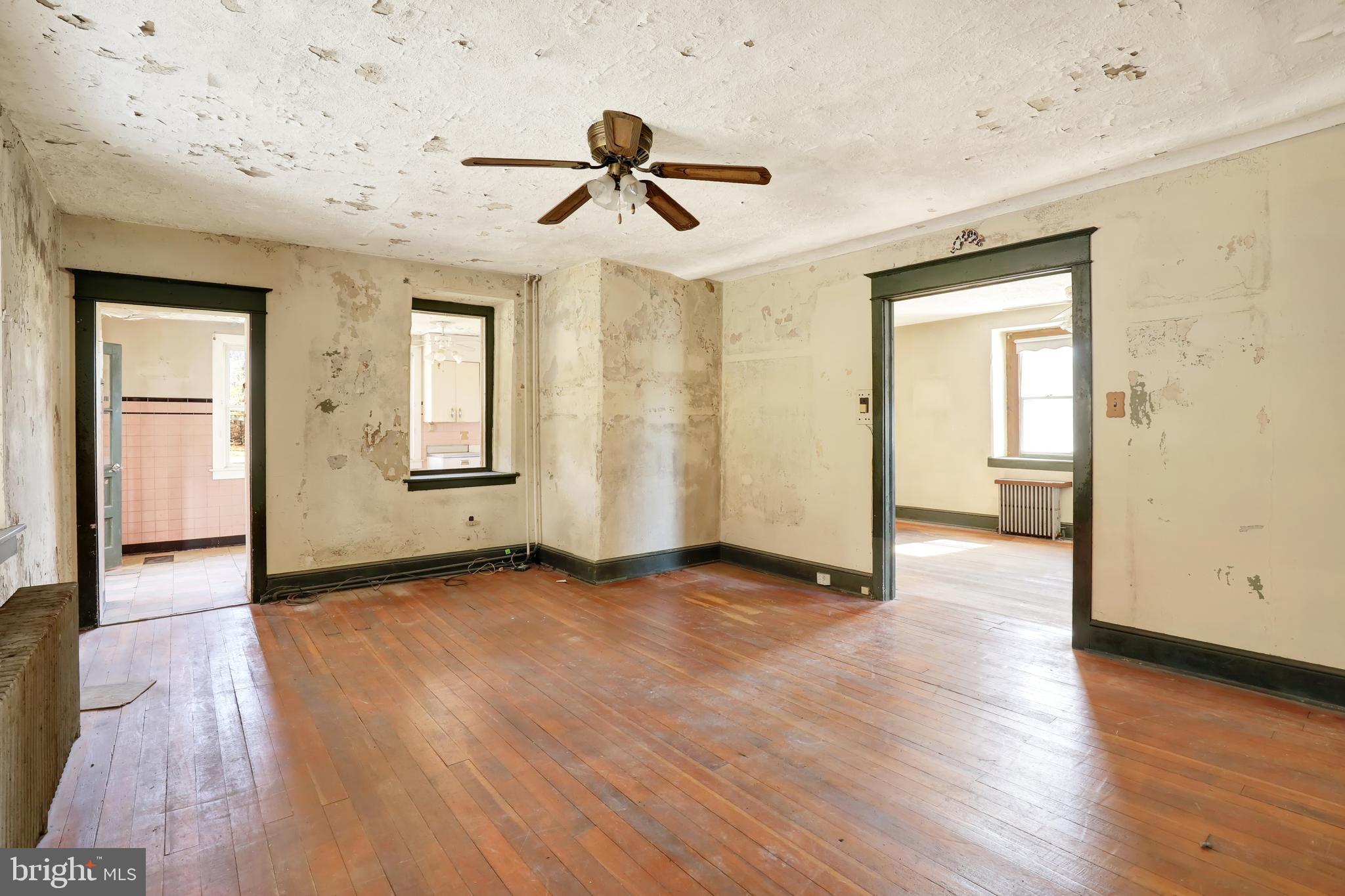 1250 New Philadelphia Road Pottstown, PA 19465 - Photo 15 of 30 an empty room with wooden floor and windows