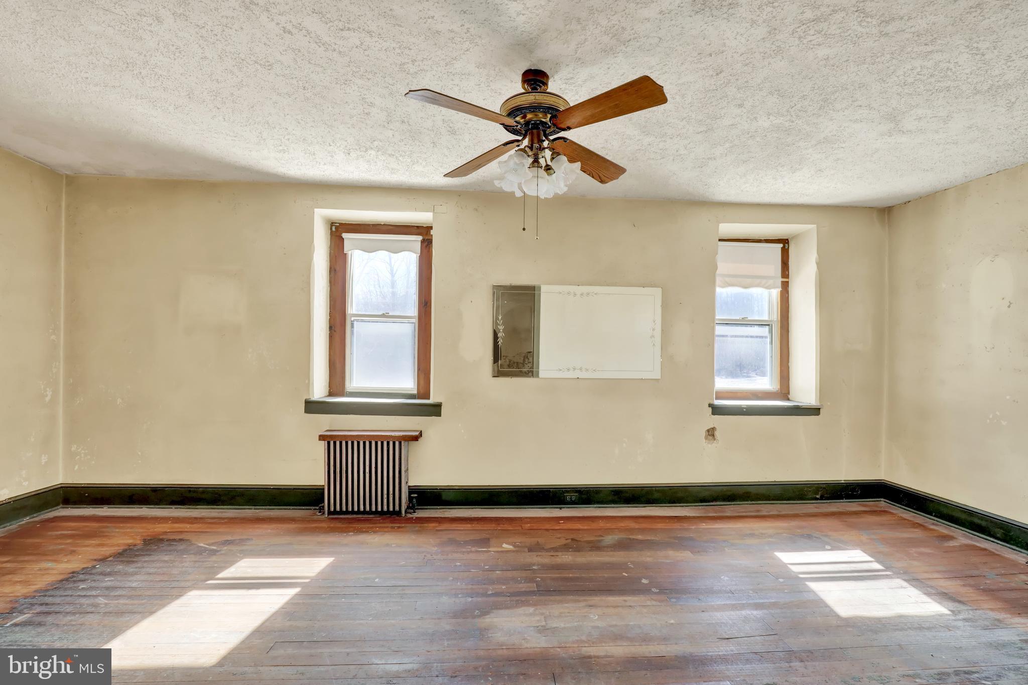 1250 New Philadelphia Road Pottstown, PA 19465 - Photo 6 of 30 a view of an empty room with wooden floor and a window