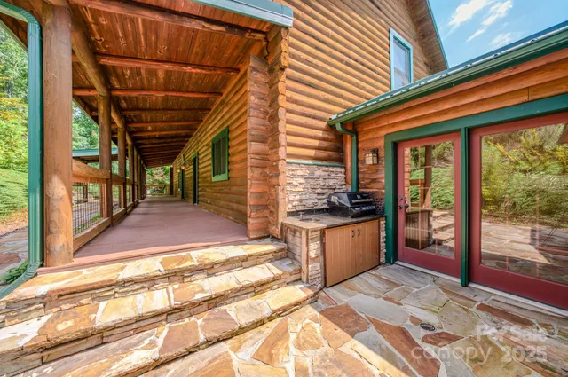a kitchen with stainless steel appliances granite countertop a sink and cabinets