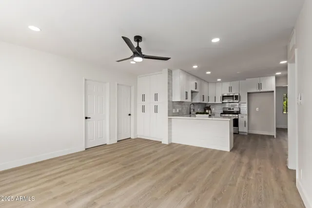 a view of kitchen view wooden floor and window