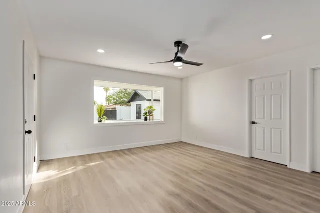 a view of room window and wooden floor