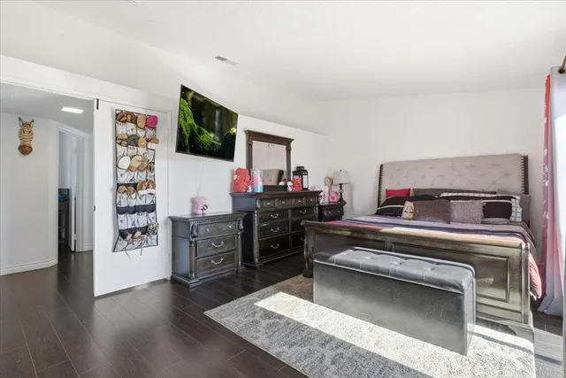 a living room with furniture and flat screen tv