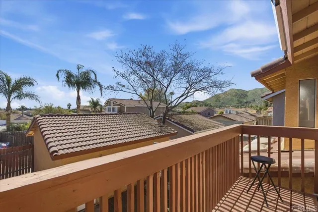 a view of a balcony with a potted plants