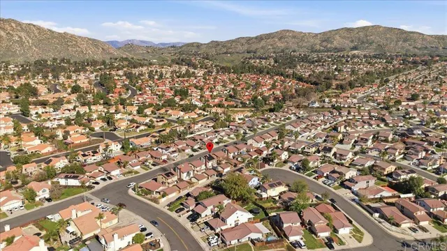 an aerial view of residential houses with outdoor space