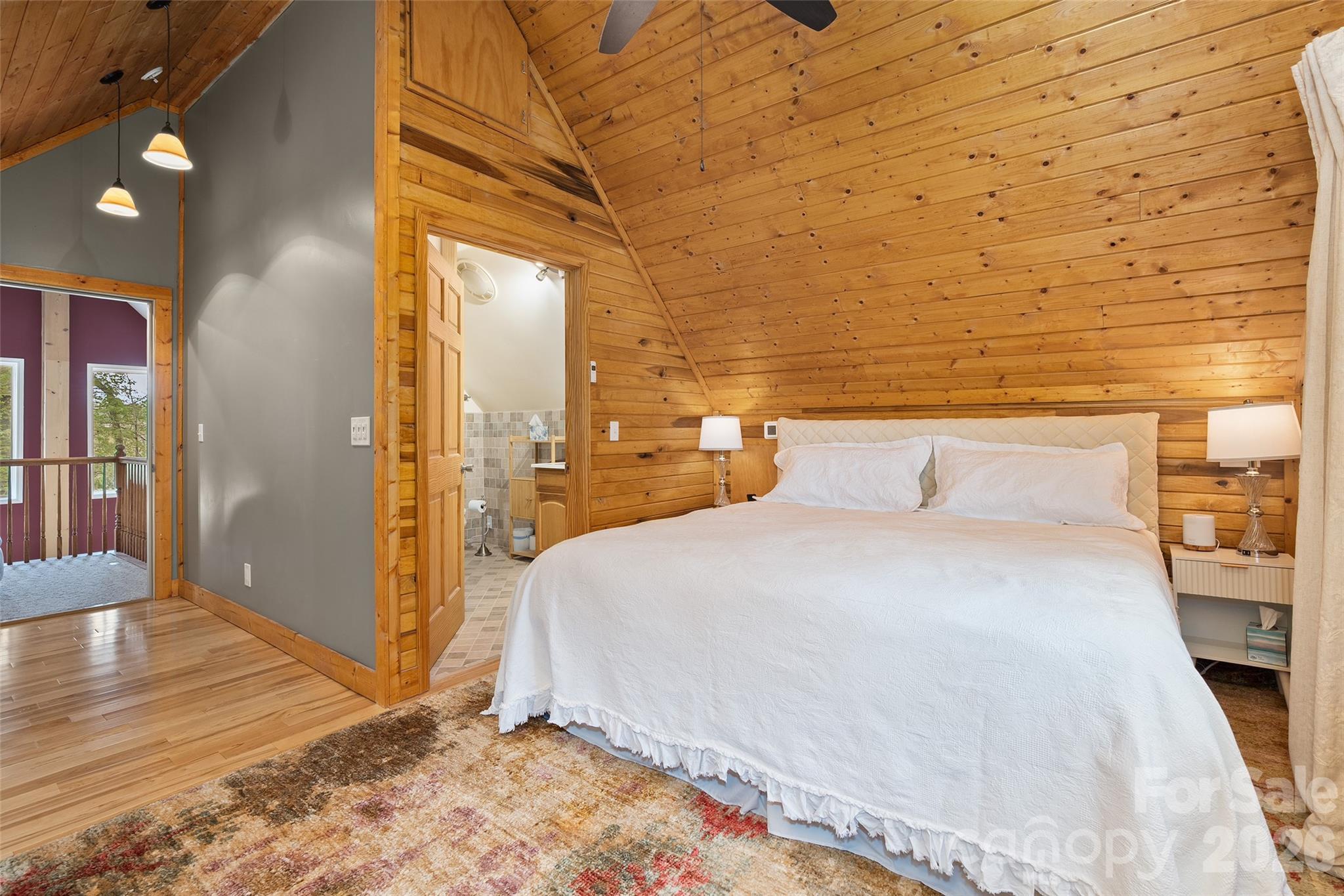 215 Atkins Loop Lake Junaluska, NC 28745 - Photo 16 of 44 a bedroom with a bed and a mirror