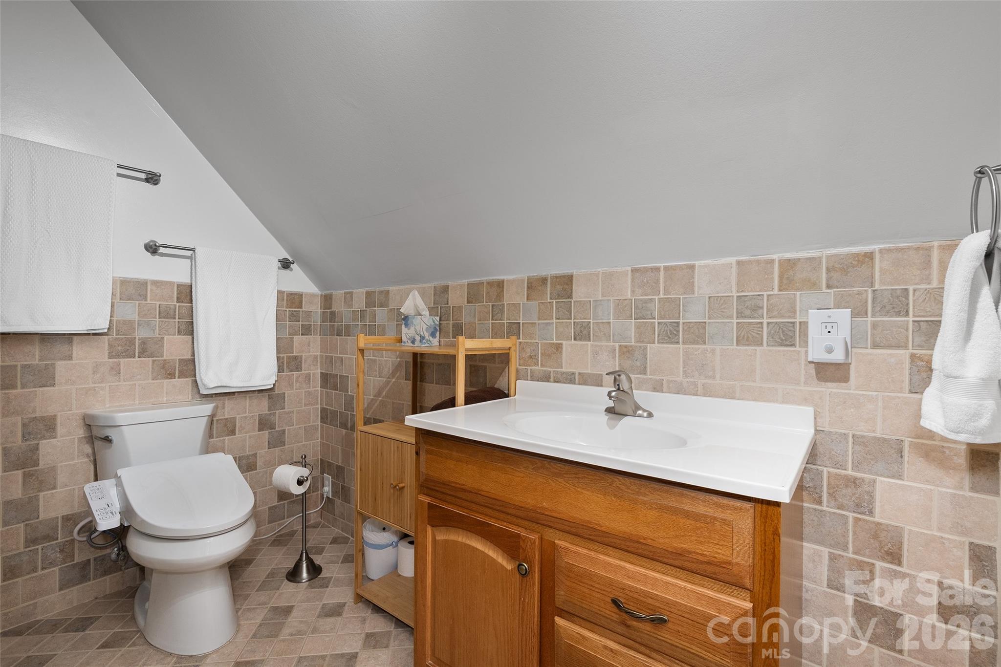 215 Atkins Loop Lake Junaluska, NC 28745 - Photo 17 of 44 a bathroom with a sink toilet and shower