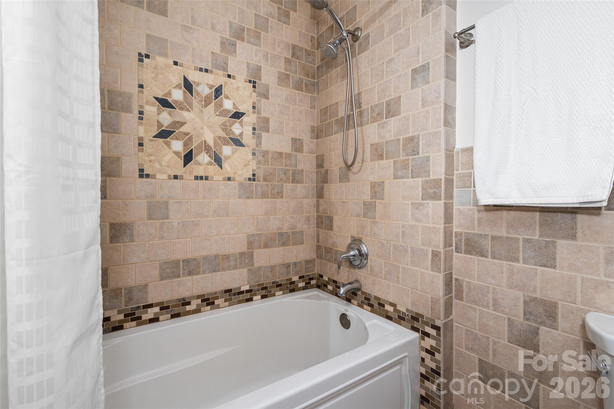 215 Atkins Loop Lake Junaluska, NC 28745 - Photo 18 of 44 a bathroom with a bathtub and shower
