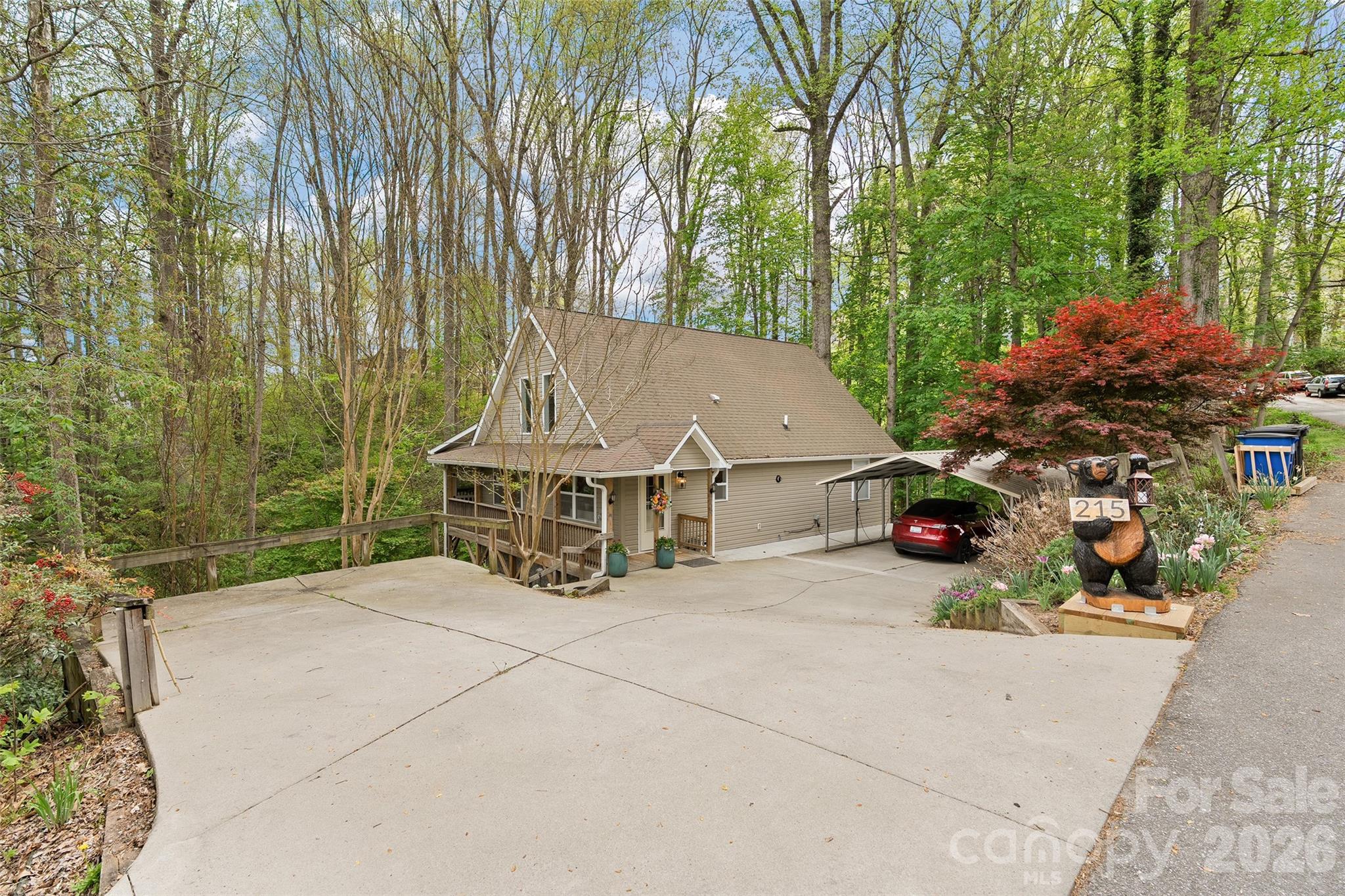 215 Atkins Loop Lake Junaluska, NC 28745 - Photo 2 of 44 an outdoor space with lots of trees in the background
