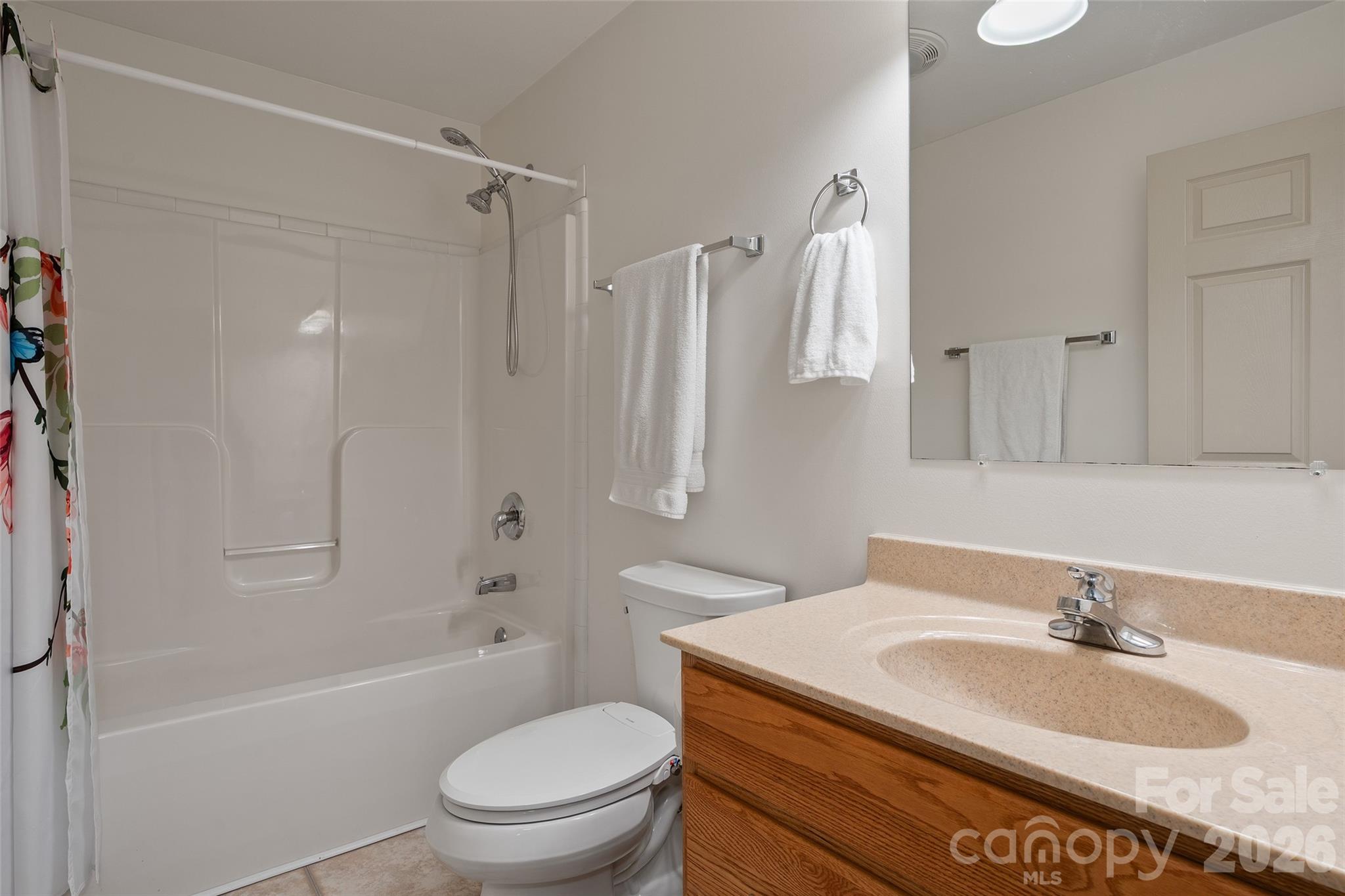 215 Atkins Loop Lake Junaluska, NC 28745 - Photo 22 of 44 a bathroom with a granite countertop sink toilet and shower