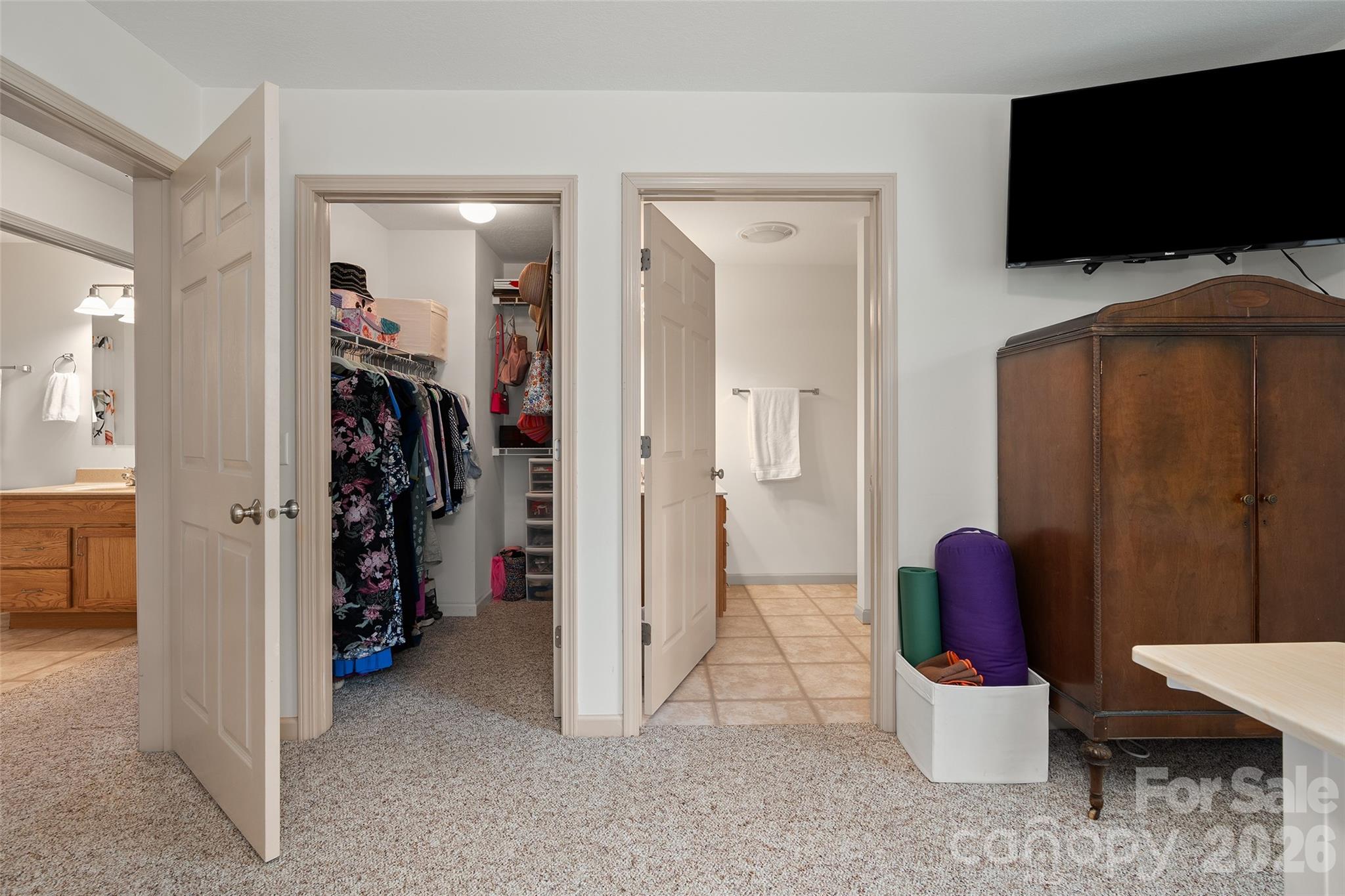 215 Atkins Loop Lake Junaluska, NC 28745 - Photo 25 of 44 a view of walk in closet with clothes and shoes