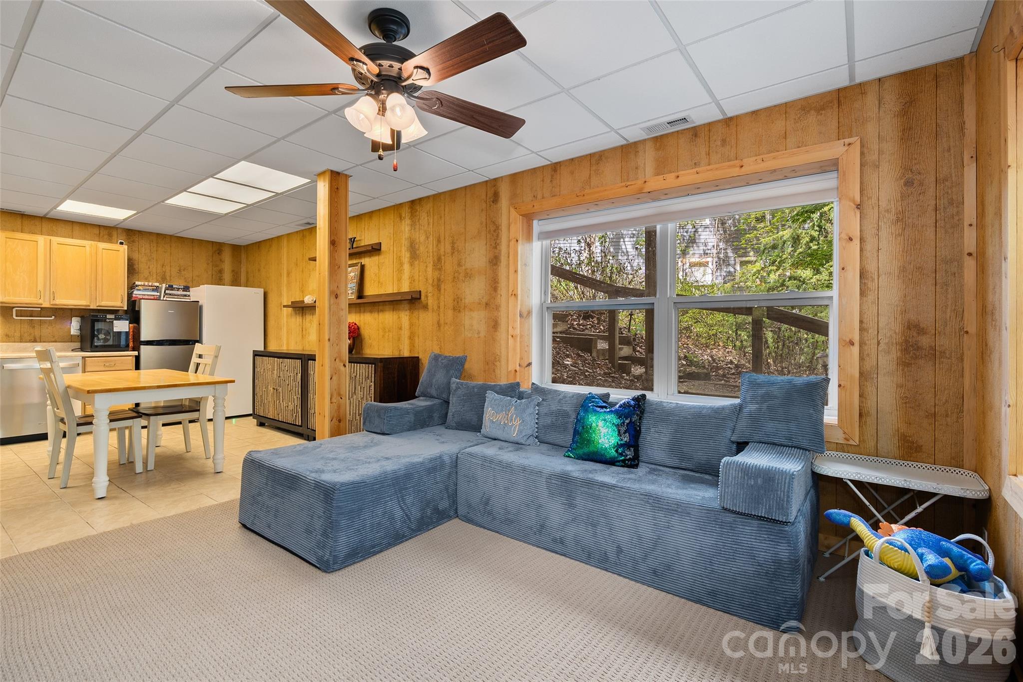 215 Atkins Loop Lake Junaluska, NC 28745 - Photo 29 of 44 a living room with furniture and a large window