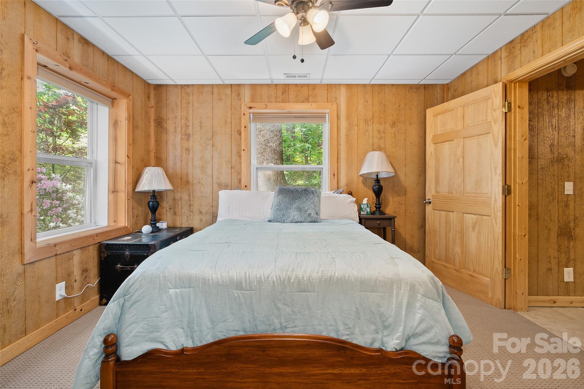 215 Atkins Loop Lake Junaluska, NC 28745 - Photo 35 of 44 a bed sitting in a bedroom next to a window