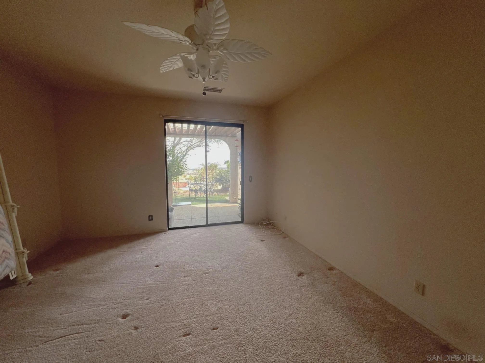 4683 Desert Vista Drive Borrego Springs, CA 92004 - Photo 20 of 32 an empty room with a chandelier fan and windows