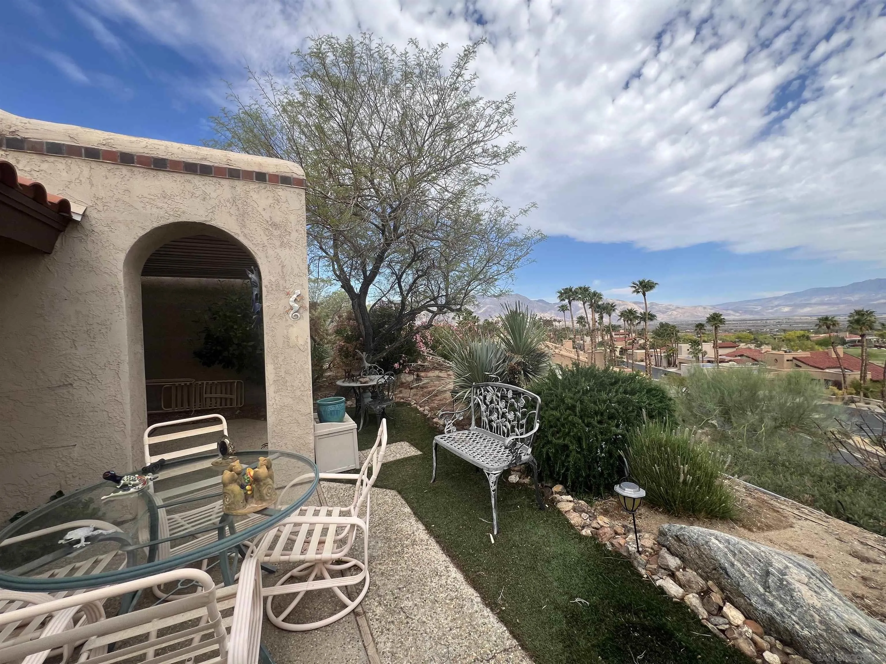 4683 Desert Vista Drive Borrego Springs, CA 92004 - Photo 21 of 32 a view of a patio with table and chairs and potted plants