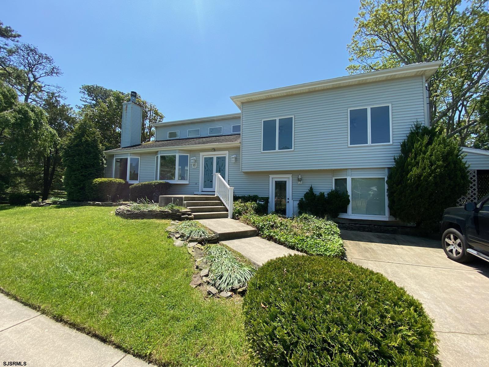20 South Laurel Drive Somers Point, NJ 08244 - Photo 1 of 39 a front view of a house with a yard