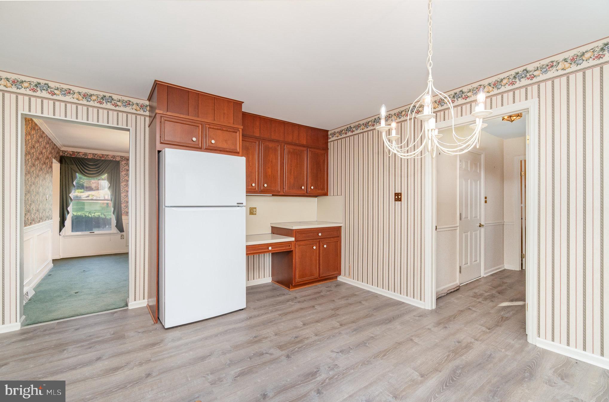 25 Estates Drive Reading, PA 19606 - Photo 16 of 43 a kitchen with a refrigerator a sink and a dishwasher with wooden floor