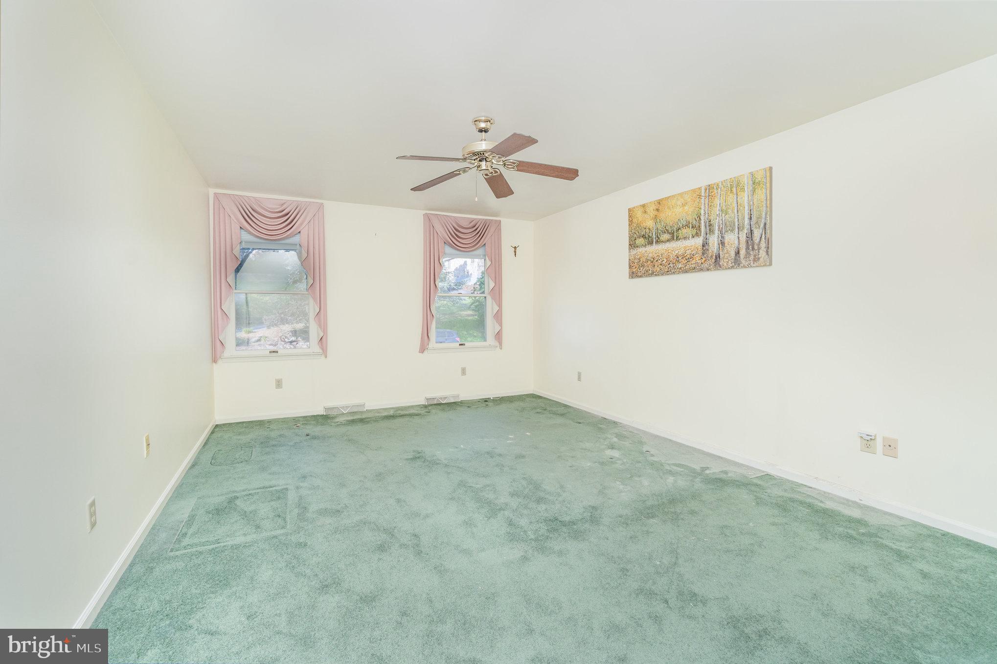 25 Estates Drive Reading, PA 19606 - Photo 19 of 43 an empty room with windows and ceiling fan view