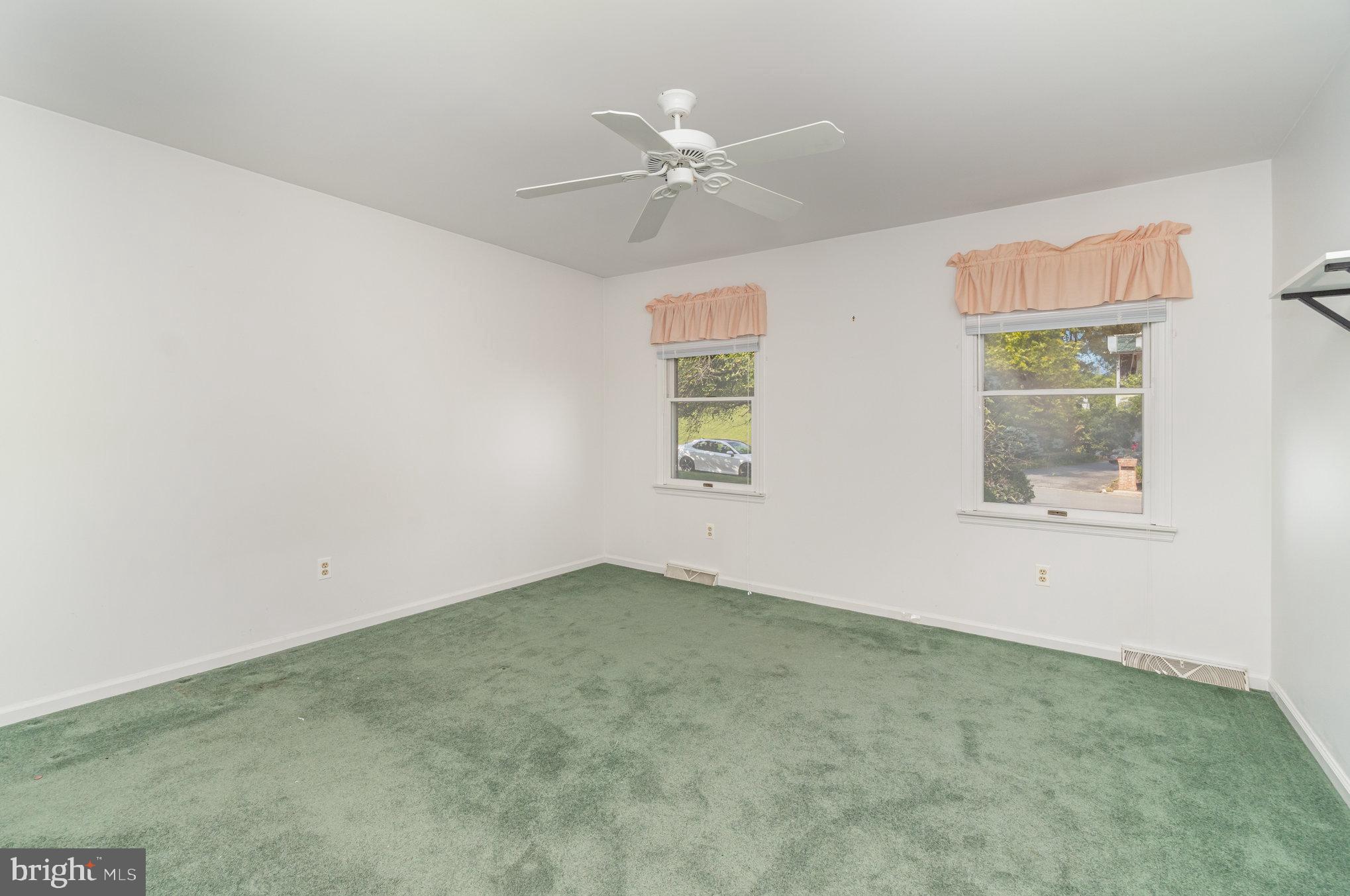 25 Estates Drive Reading, PA 19606 - Photo 24 of 43 an empty room with a window and a fan