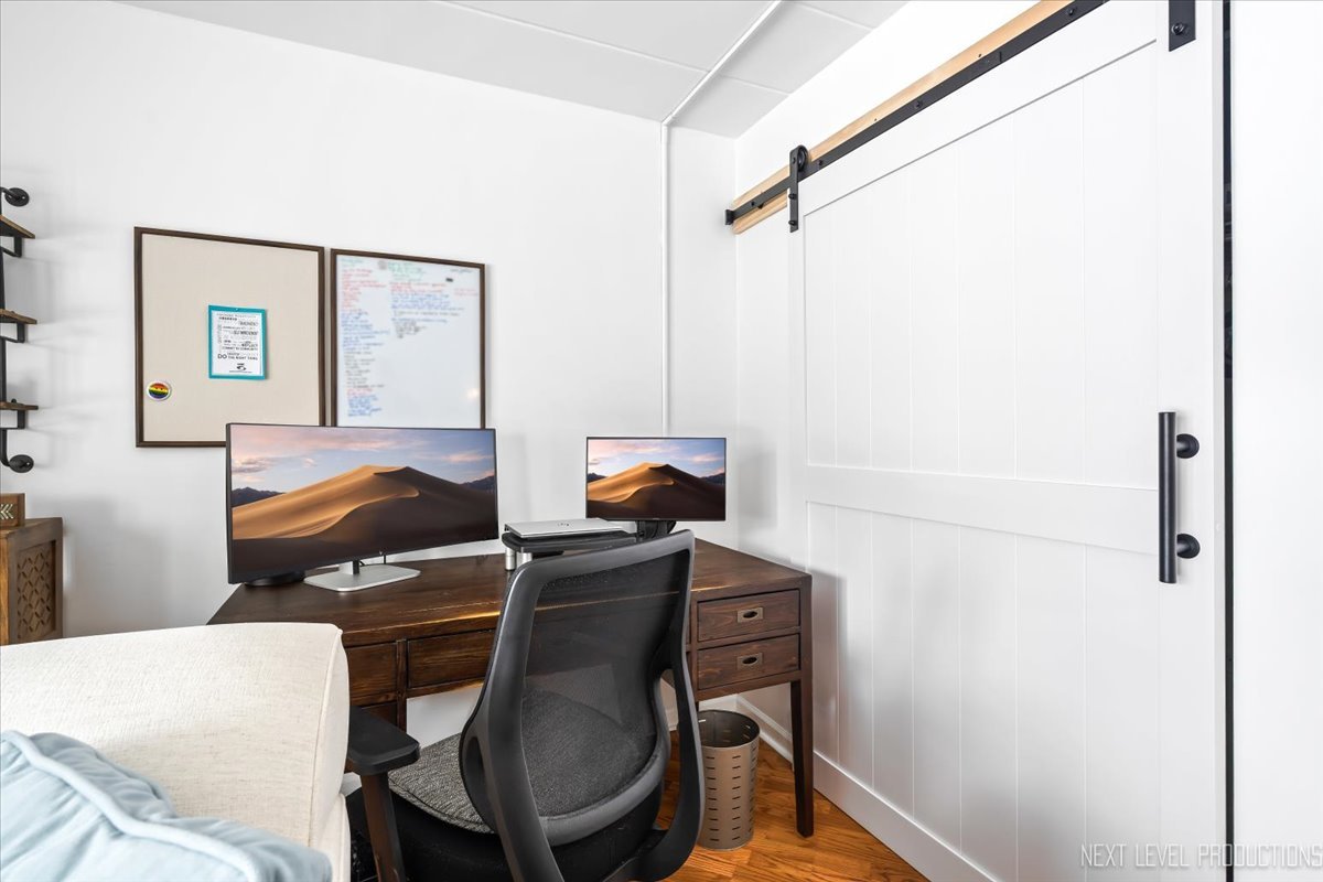 127 North Wolf Road, Unit 60A Wheeling, IL 60090 - Photo 6 of 22 a bedroom with a bed and furniture