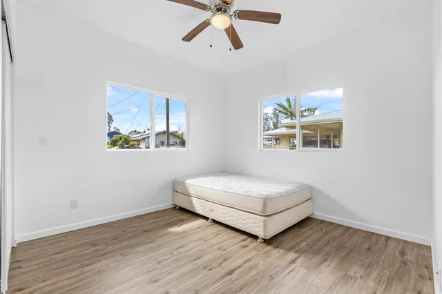 a room with a bed and window