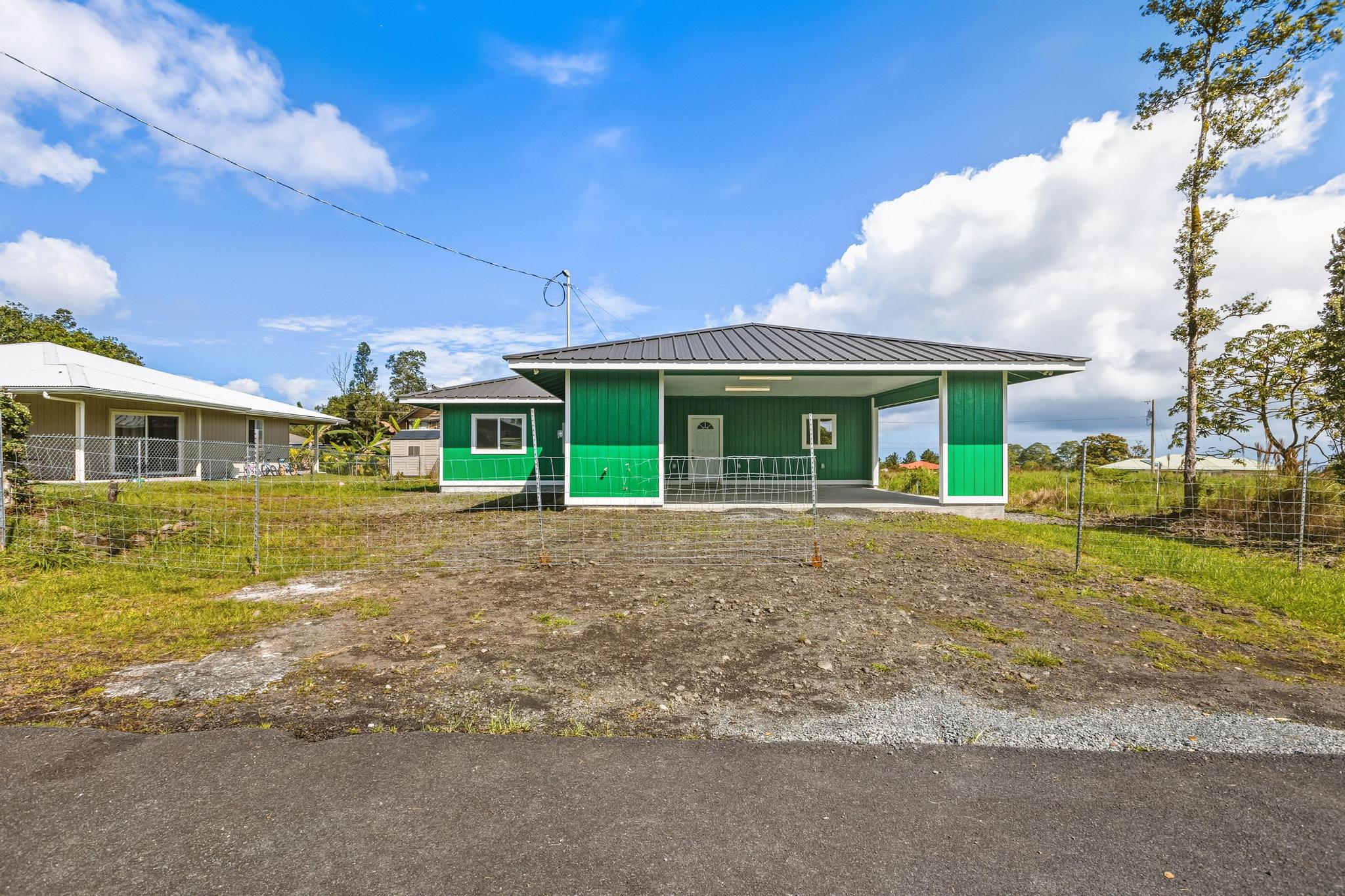 18-7842 Kaniela Road Mountain View, HI 96771 - Photo 26 of 30 a view of a house with a yard