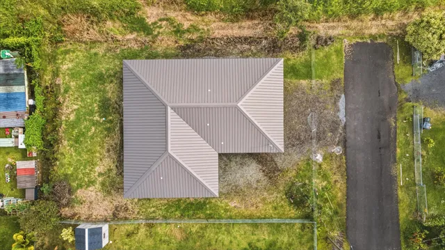 a aerial view of a house with a yard