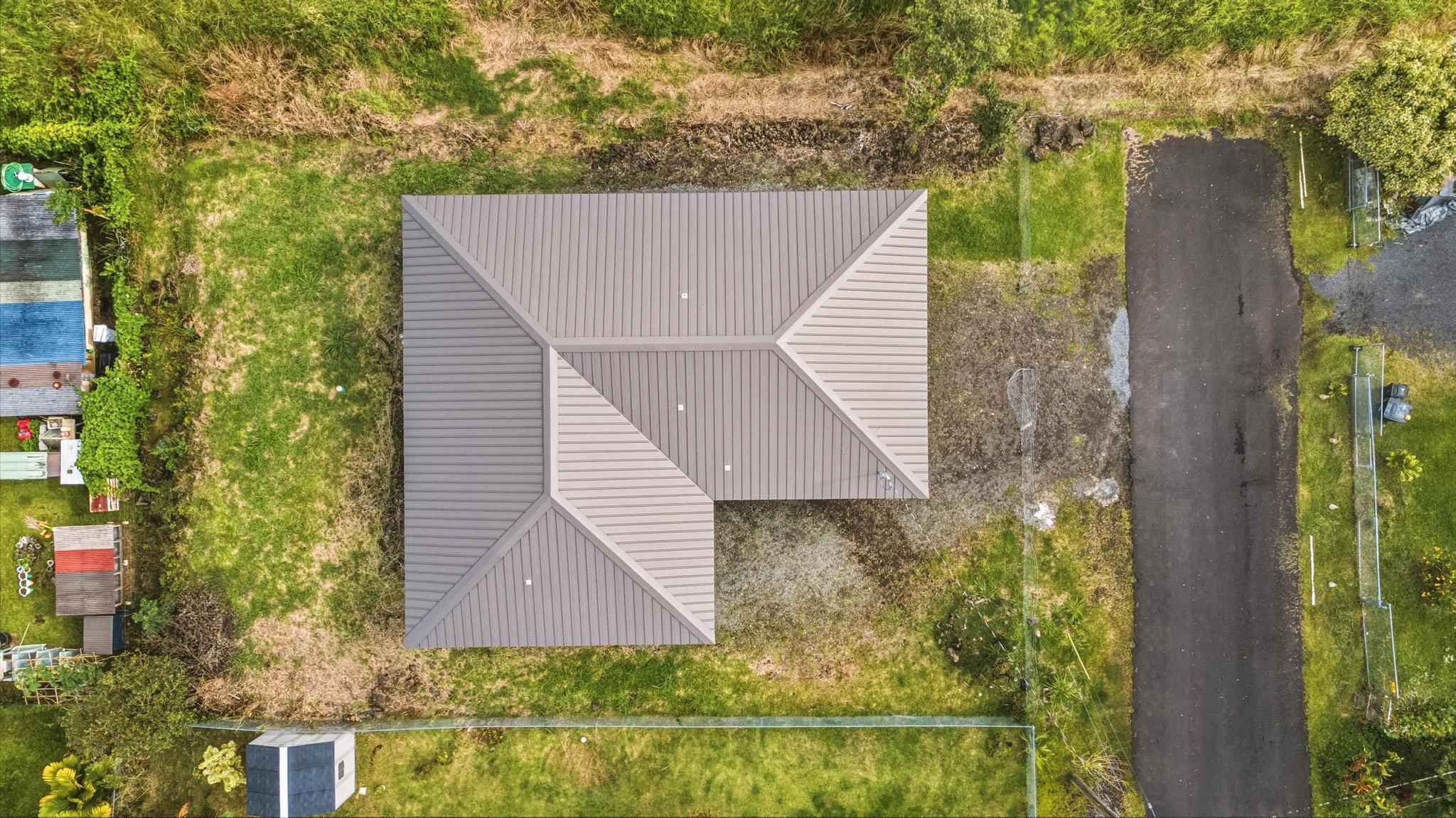 18-7842 Kaniela Road Mountain View, HI 96771 - Photo 27 of 30 a aerial view of a house with a yard