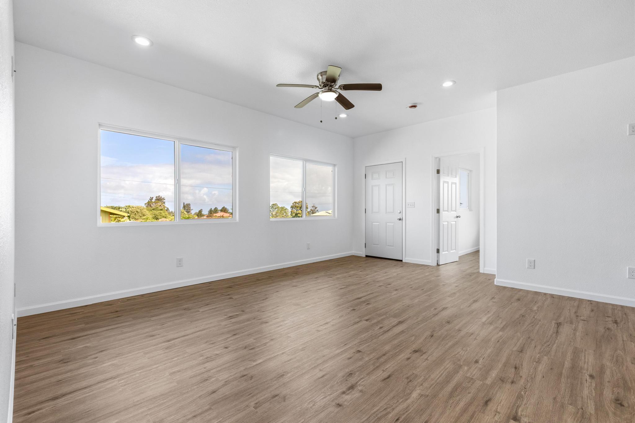 18-7842 Kaniela Road Mountain View, HI 96771 - Photo 7 of 30 wooden floor in an empty room with a window