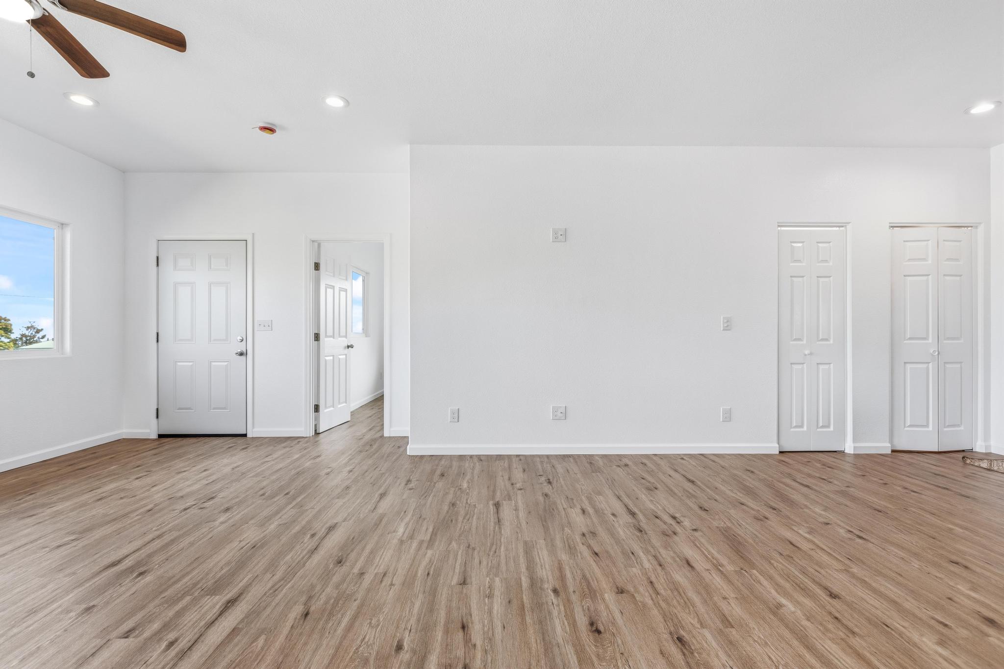18-7842 Kaniela Road Mountain View, HI 96771 - Photo 9 of 30 an empty room with wooden floor