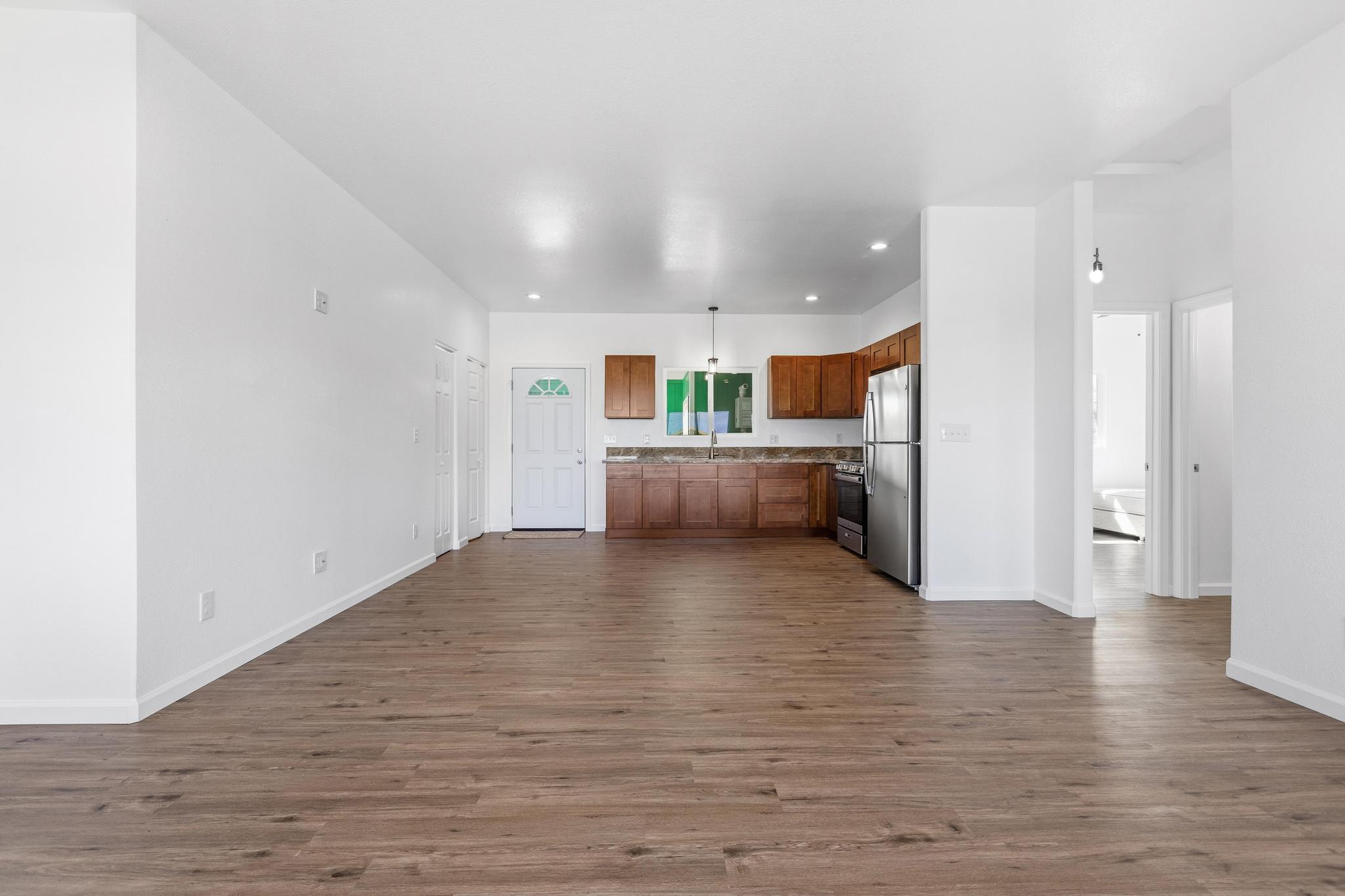 18-7842 Kaniela Road Mountain View, HI 96771 - Photo 10 of 30 a view of a kitchen with a sink cabinets and wooden floor