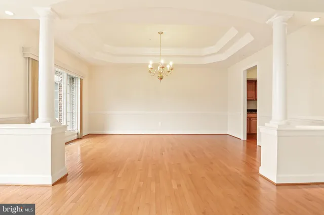 a large kitchen with stainless steel appliances granite countertop a stove refrigerator and a sink