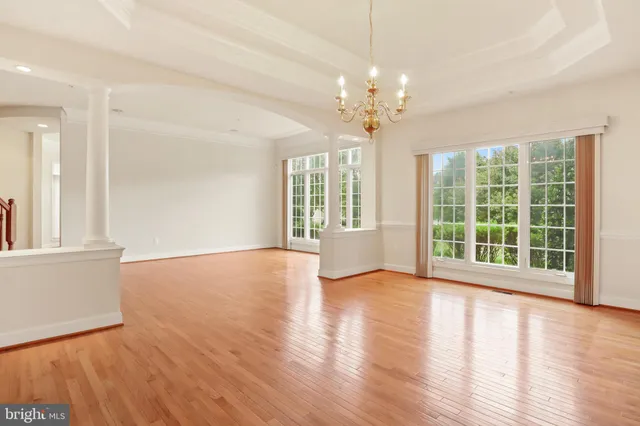 a kitchen with stainless steel appliances granite countertop a refrigerator a stove and a sink