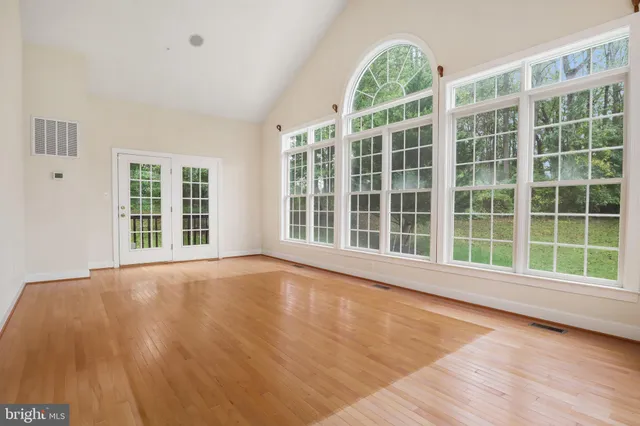 a view of a room with rack on the wall and a window