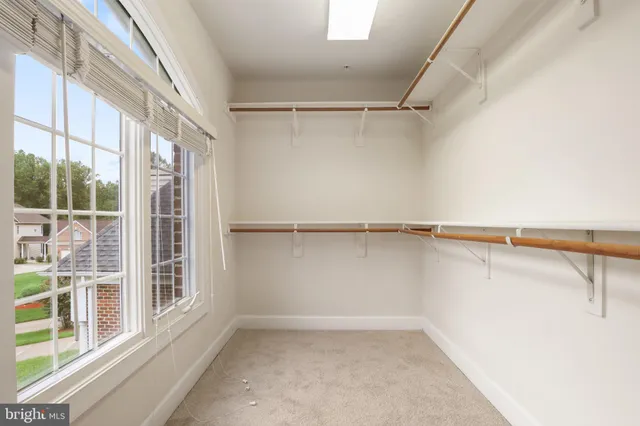 a view of an empty room with empty shelves