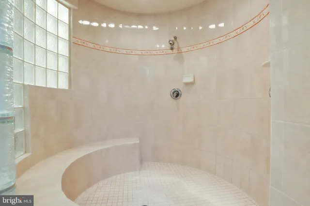 an aerial view of a house with swimming pool a yard and outdoor seating