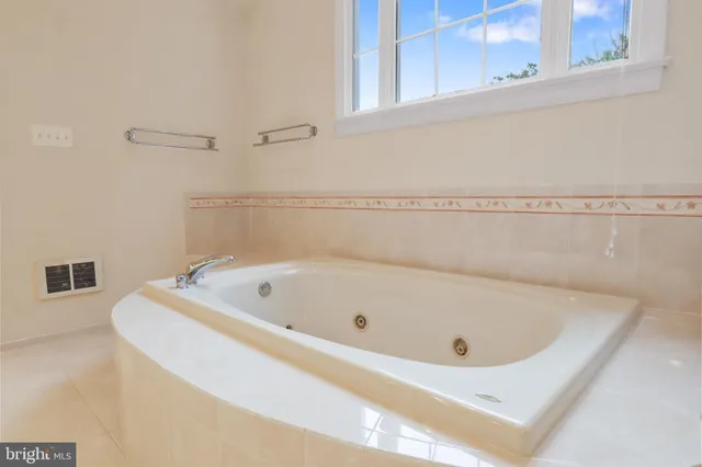 a aerial view of a house with a yard