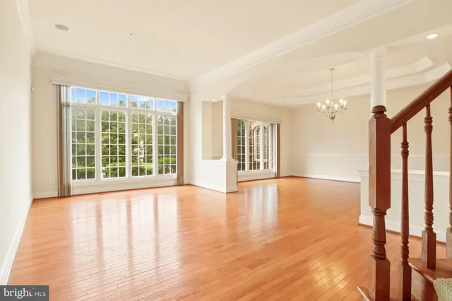 a large kitchen with stainless steel appliances granite countertop a stove a sink and a refrigerator