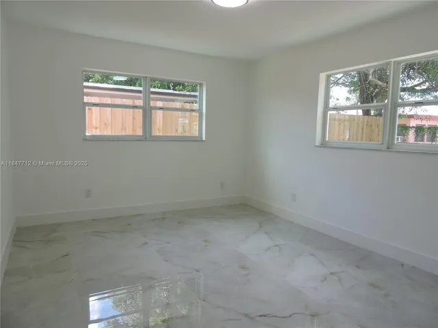 an empty room with a bathroom