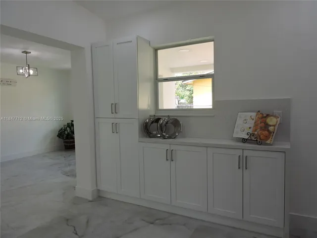 a kitchen with a refrigerator stove and sink