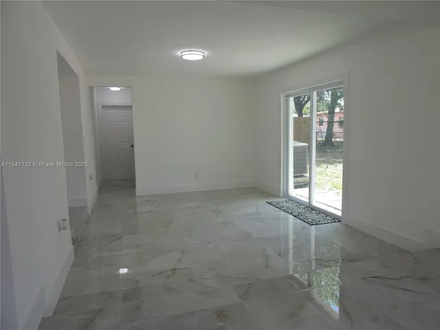 a view of a room with white walls
