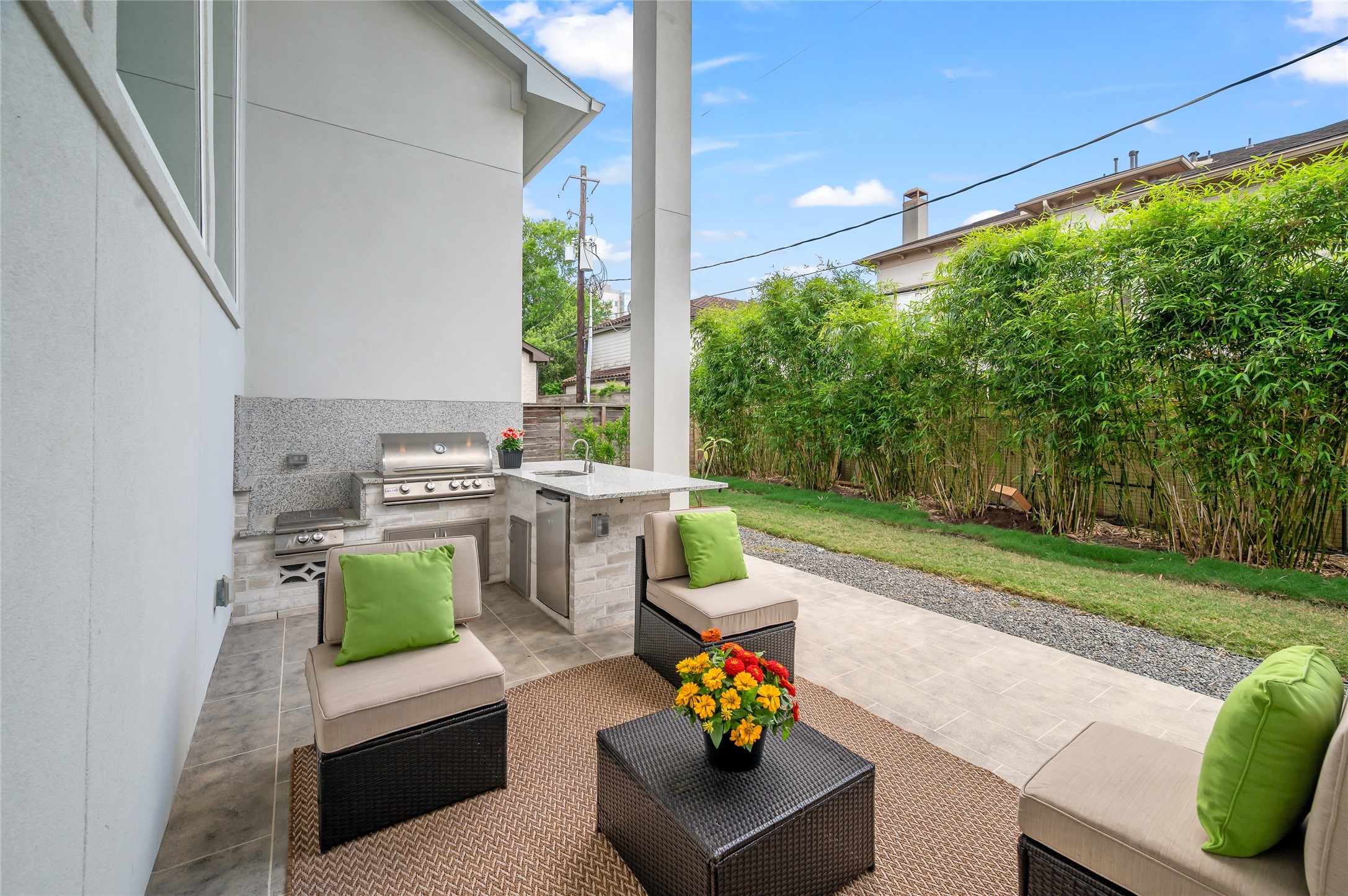 2215 MacArthur Street Houston, TX 77030 - Photo 2 of 33 Overview of the backyard covered terrace including the fully-equipped outdoor kitchen.