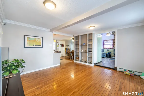 a view of livingroom with hardwood floor and stairs
