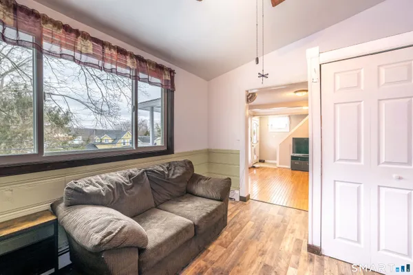 a living room with furniture and a large window
