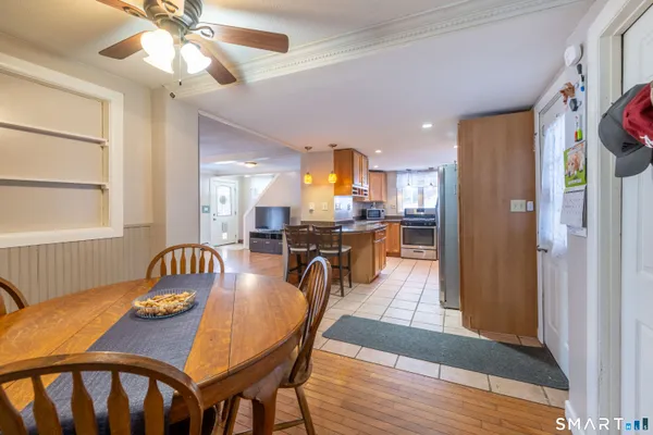 a view of a dining room with furniture and wooden floor