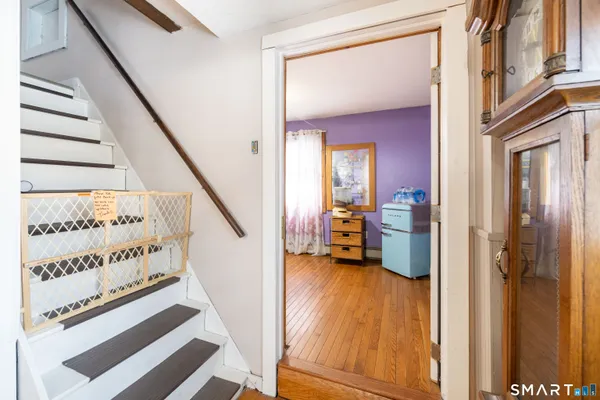a view of a hallway to a livingroom and a hallway
